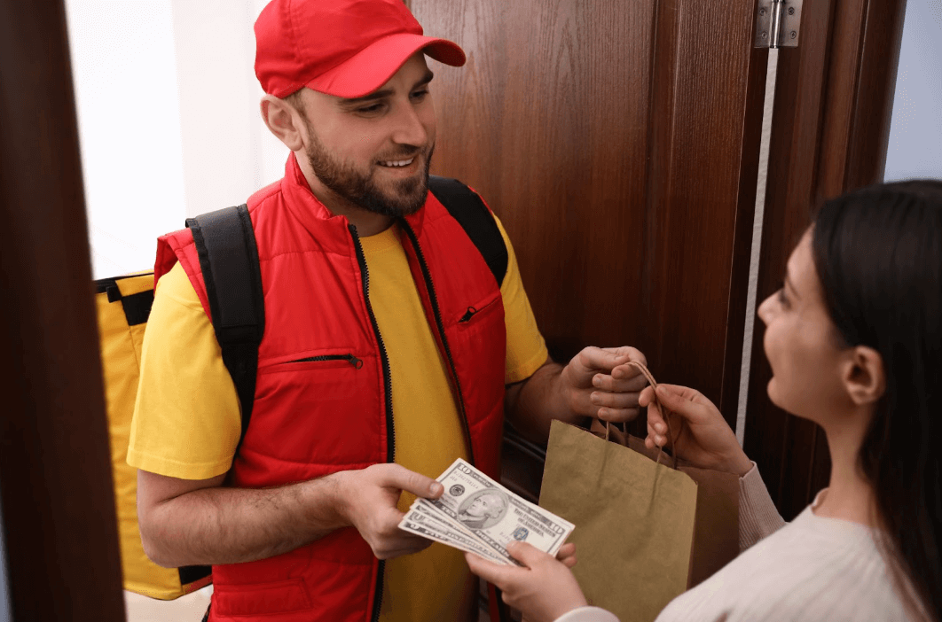 delivery driver delivering food and receiving money